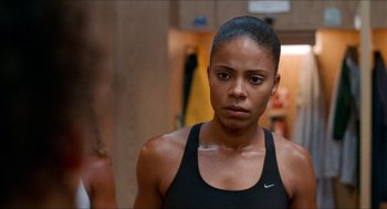 Movie still from “Love & Basketball” (2000), directed by Gina Prince-Bythewood – A person wearing a tank top; Close Up shot, Over the shoulder angle