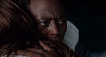 Movie still from “Love & Basketball” (2000), directed by Gina Prince-Bythewood – A person holding his head; Close Up shot, Over the shoulder angle