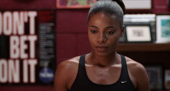 Movie still from “Love & Basketball” (2000), directed by Gina Prince-Bythewood – A person wearing a tank top; Close Up shot, Over the shoulder angle
