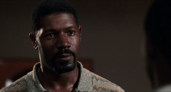 Movie still from “Love & Basketball” (2000), directed by Gina Prince-Bythewood – A person wearing a shirt; Close Up shot, Over the shoulder angle