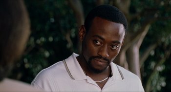 Movie still from “Love & Basketball” (2000), directed by Gina Prince-Bythewood – A person wearing a white shirt; Close Up shot, Over the shoulder angle