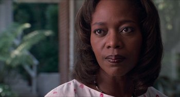 Movie still from “Love & Basketball” (2000), directed by Gina Prince-Bythewood – A person wearing a white and pink shirt; Close Up shot, Low angle