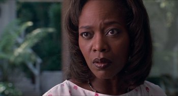 Movie still from “Love & Basketball” (2000), directed by Gina Prince-Bythewood – A person looking at the camera; Close Up shot, Low angle