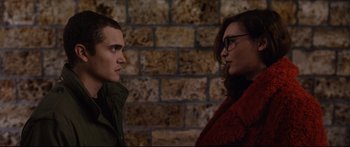 Movie still from “Love” (2015), directed by Gaspar Noé – A man and a woman standing next to each other in front of a brick wall; Close Up shot, Over the shoulder angle