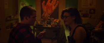 Movie still from “Love” (2015), directed by Gaspar Noé – A man and a woman are looking at each other; Medium shot, Over the shoulder angle