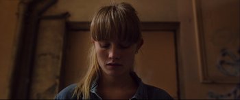 Movie still from “Love” (2015), directed by Gaspar Noé – A woman with her eyes closed in a room; Close Up shot, Low angle