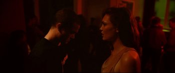 Movie still from “Love” (2015), directed by Gaspar Noé – A man and a woman talking to each other; Medium shot, Over the shoulder angle