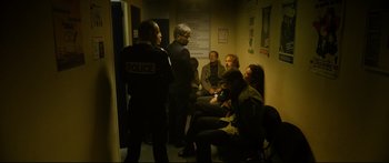 Movie still from “Love” (2015), directed by Gaspar Noé – A group of people sitting in a waiting room; Wide shot, High angle