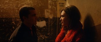 Movie still from “Love” (2015), directed by Gaspar Noé – A man and a woman talking to each other; Close Up shot, Over the shoulder angle