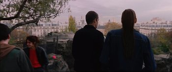 Movie still from “Love” (2015), directed by Gaspar Noé – Two people looking out over a city from a park; Medium shot, Over the shoulder angle
