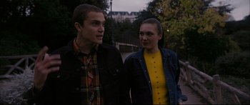 Movie still from “Love” (2015), directed by Gaspar Noé – A man and a woman are walking together; Medium shot, Over the shoulder angle