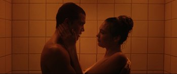 Movie still from “Love” (2015), directed by Gaspar Noé – A man and a woman in the shower together; Close Up shot, Low angle