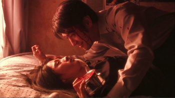Movie still from “Love Exposure” (2008), directed by Sion Sono – A man and a woman are eating food; Extreme Close Up shot, High angle