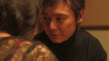 Movie still from “Love Exposure” (2008), directed by Sion Sono – A person looking at the camera; Close Up shot, Over the shoulder angle