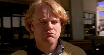 Movie still from “Love Liza” (2002), directed by Todd Louiso – A person wearing a jacket; Close Up shot, Low angle