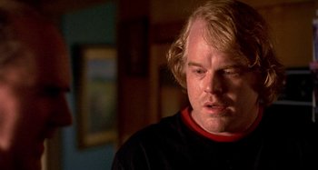 Movie still from “Love Liza” (2002), directed by Todd Louiso – A person wearing a black shirt; Close Up shot, Over the shoulder angle