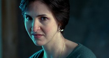 Movie still from “Love Liza” (2002), directed by Todd Louiso – A person wearing a green shirt; Close Up shot, Over the shoulder angle