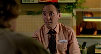 Movie still from “Love Liza” (2002), directed by Todd Louiso – A man wearing a shirt and a tie; Close Up shot, High angle