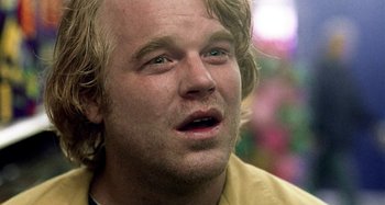 Movie still from “Love Liza” (2002), directed by Todd Louiso – A person with blond hair; Close Up shot, Over the shoulder angle