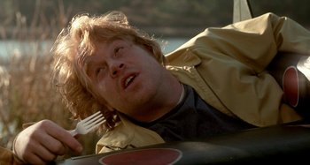 Movie still from “Love Liza” (2002), directed by Todd Louiso – A person holding a plastic fork; Close Up shot, Overhead angle
