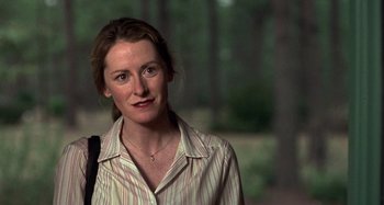 Movie still from “Love Liza” (2002), directed by Todd Louiso – A person wearing a striped shirt; Close Up shot, Over the shoulder angle