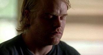 Movie still from “Love Liza” (2002), directed by Todd Louiso – A person with his eyes closed; Close Up shot, Over the shoulder angle