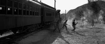 Movie still from “Love Me Tender” (1956), directed by Robert D. Webb – A black and white photo of a group of men playing baseball; Extreme Wide shot, High angle