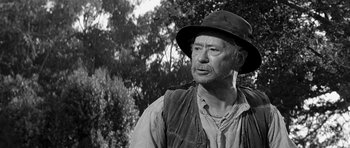 Movie still from “Love Me Tender” (1956), directed by Robert D. Webb – An older man wearing a hat and a vest; Close Up shot, Low angle