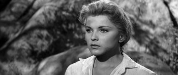 Movie still from “Love Me Tender” (1956), directed by Robert D. Webb – Black and white photograph of a young woman looking at the camera; Close Up shot, Low angle