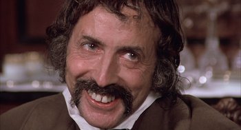 Movie still from “Love and Death” (1975), directed by Woody Allen – A person with a beard and mustache; Close Up shot, Low angle