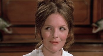 Movie still from “Love and Death” (1975), directed by Woody Allen – A person wearing a white shirt; Close Up shot, High angle