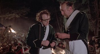 Movie still from “Love and Death” (1975), directed by Woody Allen – Two men in military garb looking at each other; Medium shot, Over the shoulder angle