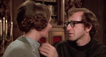 Movie still from “Love and Death” (1975), directed by Woody Allen – A man and a woman looking at one another; Close Up shot, Over the shoulder angle