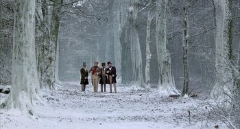 Movie still from “Love and Death” (1975), directed by Woody Allen – A group of people standing in the middle of a snowy forest; Extreme Wide shot, Low angle