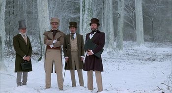 Movie still from “Love and Death” (1975), directed by Woody Allen – A group of men standing next to each other in the snow; Wide shot, Low angle