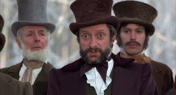 Movie still from “Love and Death” (1975), directed by Woody Allen – A man with a beard wearing a top hat; Close Up shot, Low angle