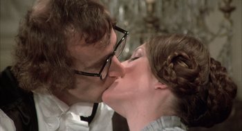 Movie still from “Love and Death” (1975), directed by Woody Allen – A man and a woman kissing each other in front of a mirror; Close Up shot, Low angle
