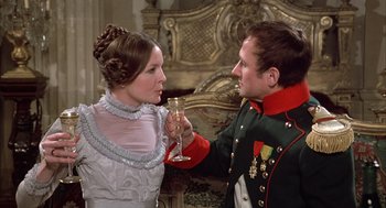 Movie still from “Love and Death” (1975), directed by Woody Allen – A man and a woman holding a glass of champagne; Medium shot, Over the shoulder angle