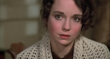Movie still from “Love and Death” (1975), directed by Woody Allen – A person wearing a sweater; Close Up shot, Over the shoulder angle
