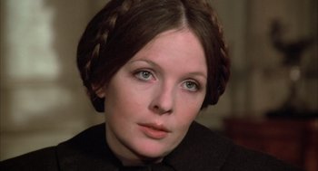 Movie still from “Love and Death” (1975), directed by Woody Allen – A person wearing a black shirt; Close Up shot, Over the shoulder angle