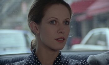 Movie still from “Love on the Run” (1979), directed by François Truffaut – A person sitting in a car; Close Up shot, Low angle