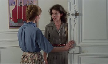 Movie still from “Love on the Run” (1979), directed by François Truffaut – Two women standing in front of a door; Medium shot, Over the shoulder angle