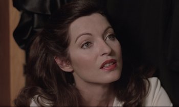 Movie still from “Love on the Run” (1979), directed by François Truffaut – A person with long brown hair; Close Up shot, High angle