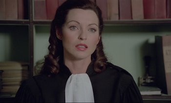 Movie still from “Love on the Run” (1979), directed by François Truffaut – A person wearing a robe; Close Up shot, High angle