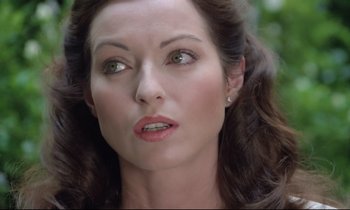 Movie still from “Love on the Run” (1979), directed by François Truffaut – A woman's face in a forest; Close Up shot, High angle