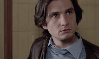 Movie still from “Love on the Run” (1979), directed by François Truffaut – A person with long hair; Close Up shot, Over the shoulder angle