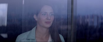 Movie still from “Loveless” (2017), directed by Andrey Zvyagintsev – A beautiful young lady standing in front of a window; Close Up shot, Low angle