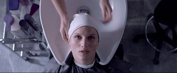 Movie still from “Loveless” (2017), directed by Andrey Zvyagintsev – A woman getting her hair washed in a hair salon; Close Up shot, Over the shoulder angle