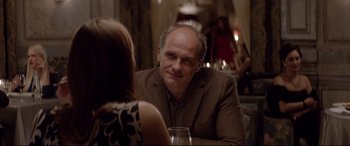 Movie still from “Loveless” (2017), directed by Andrey Zvyagintsev – A man sitting at a table with a woman in front of him; Close Up shot, Over the shoulder angle