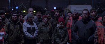 Movie still from “Loveless” (2017), directed by Andrey Zvyagintsev – A group of people standing in the dark; Medium shot, Low angle
